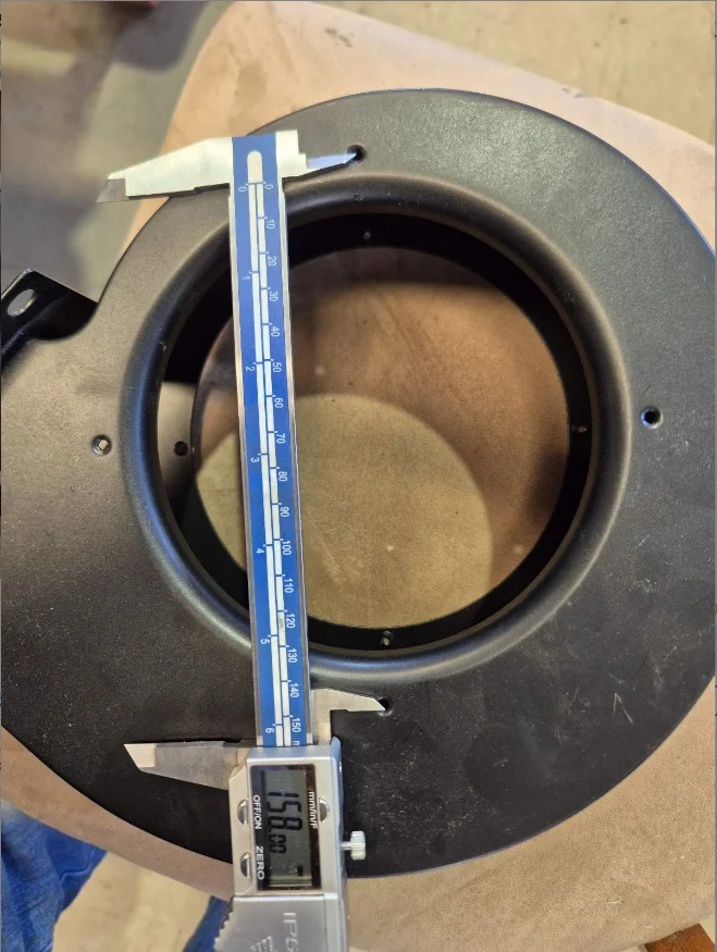 A caliper showing the exact 158 mm hole span on the 24V DC centrifugal blower