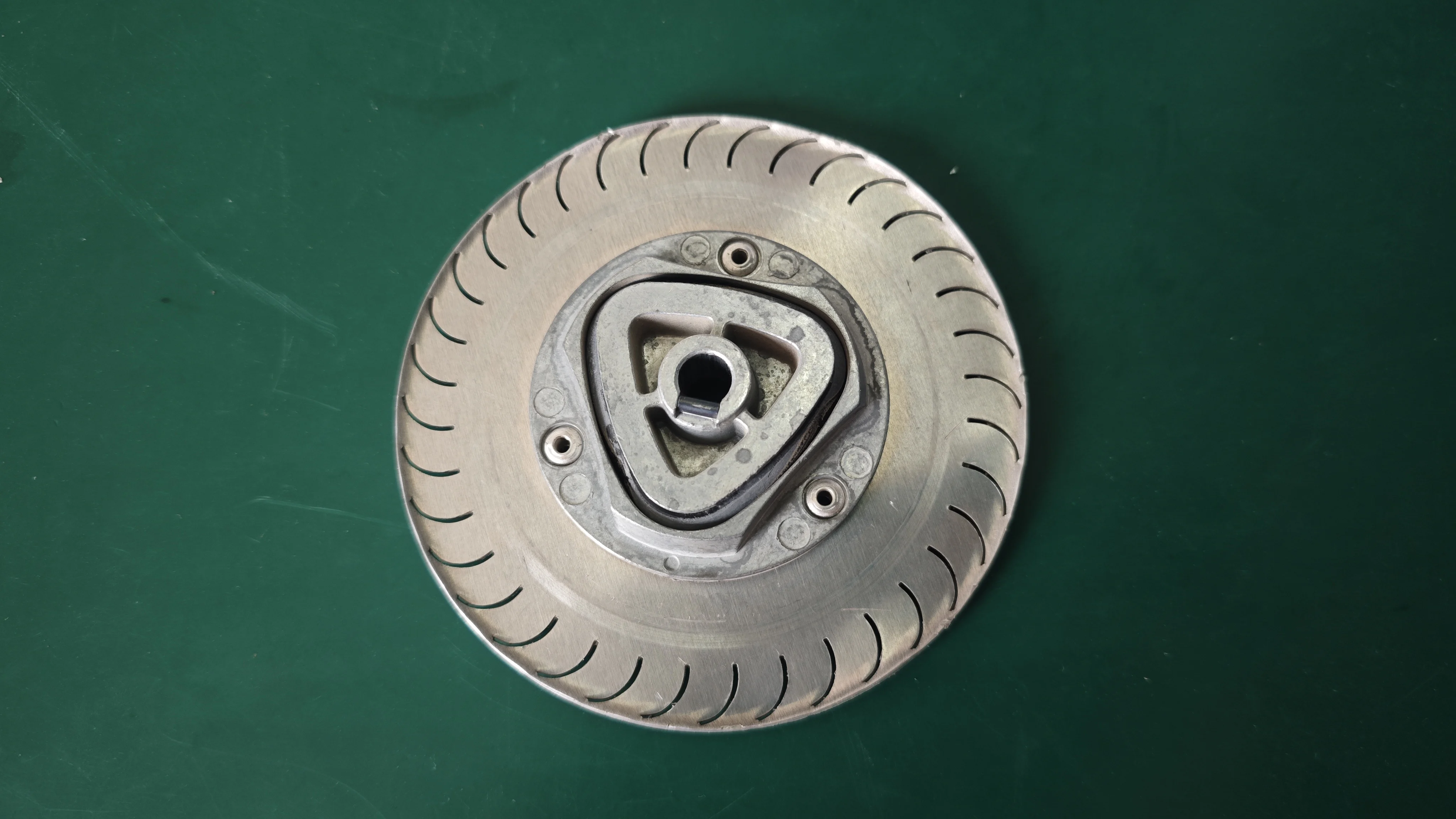Detail view of the D-shaped hub interface that connects to the drive motor