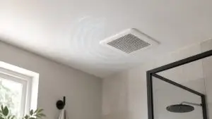 Ceiling exhaust grille with subtle illustrative sound ripples in a dry residential bathroom