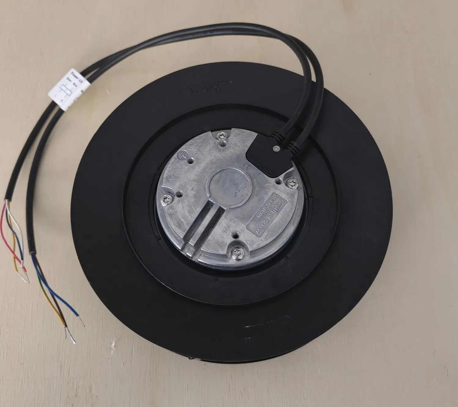 Rear of a backward-curved EC fan showing the PA6+GF30 moulding mark, motor plate and separate power and control leads