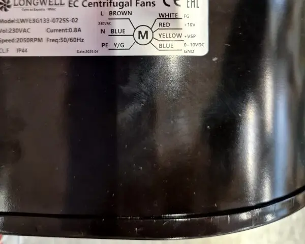 EC centrifugal fan unpacked on site, the LONGWELL nameplate readable including the 2025.04 build date.