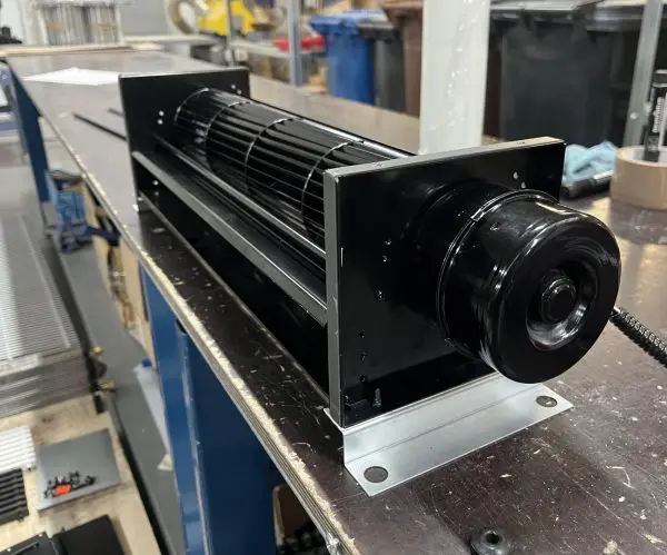 A fully assembled cross-flow (tangential) fan long drum impeller in a sheet-steel frame, with an end-mounted extern