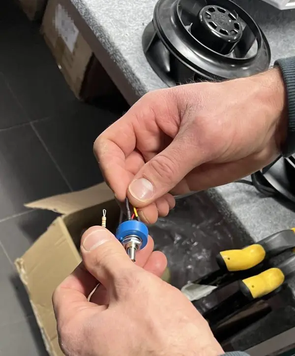 On site at a customer workshop during our December 2023 European customer visit: a technician prepares a panel-moun