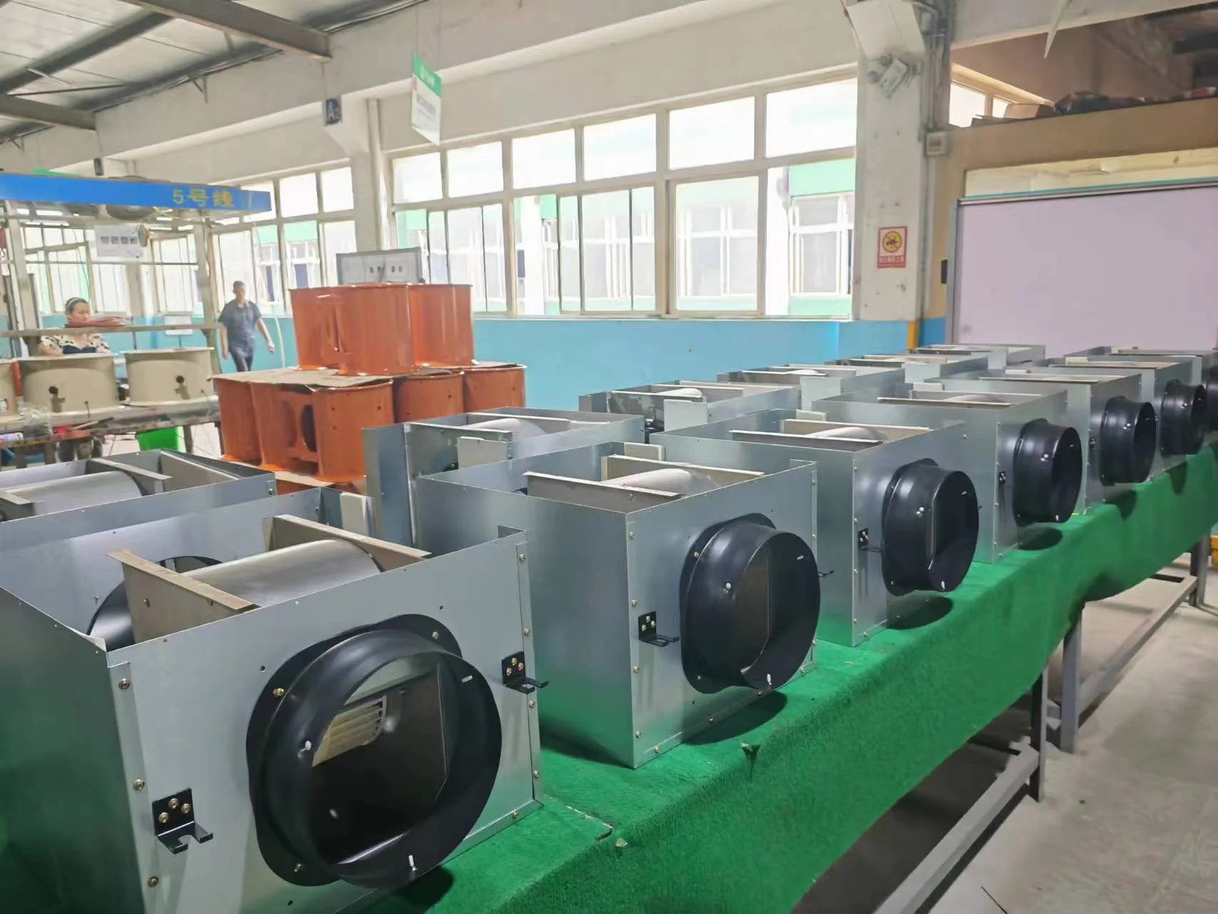 Rows of finished industrial blowers.