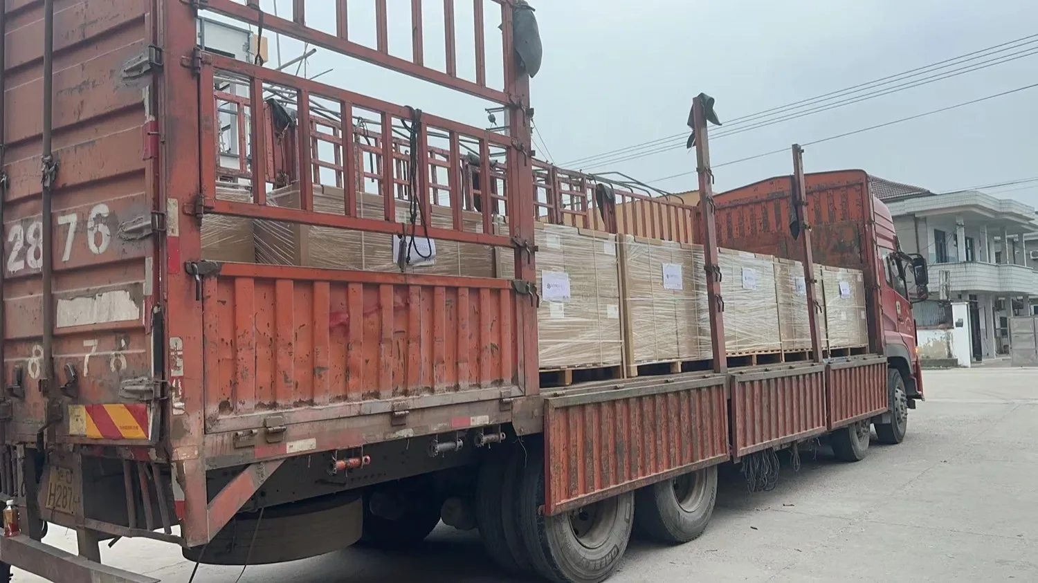 Palletised and stretch-wrapped fan cartons loaded on a truck for despatch