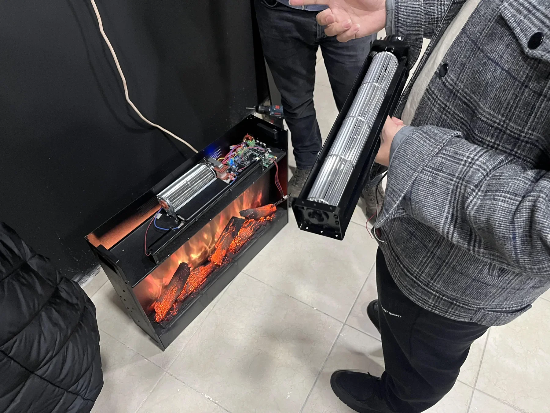 Distributor discussion around an electric-fireplace application.