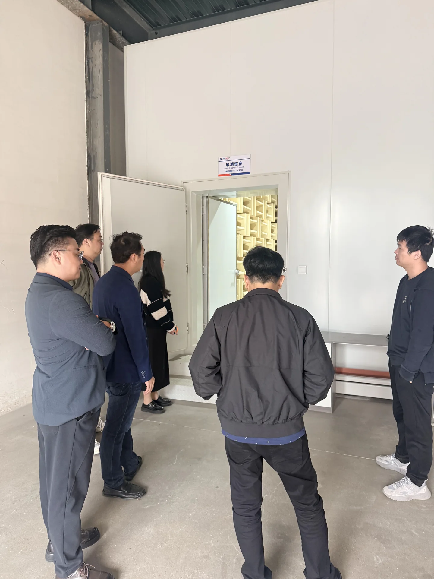 The visiting team moves through a LONGWELL production area.